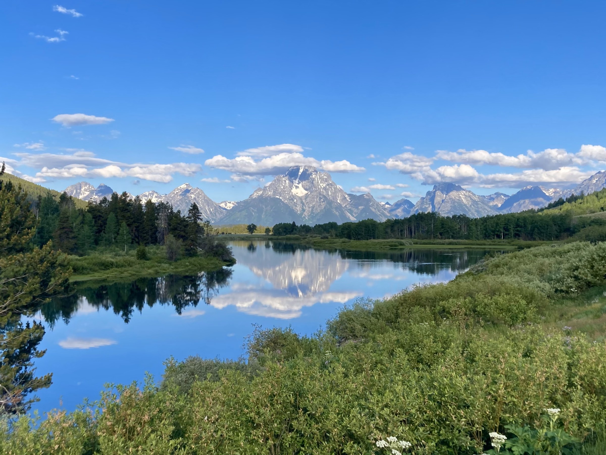 a body of water with a mountain in the background