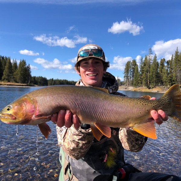 a person holding a fish