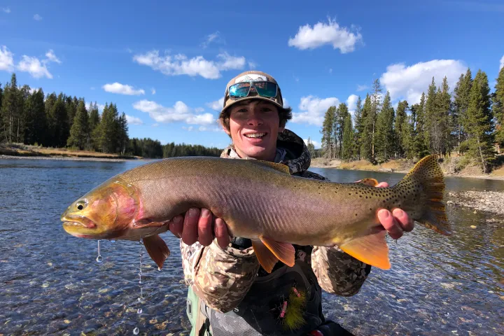 a person holding a fish