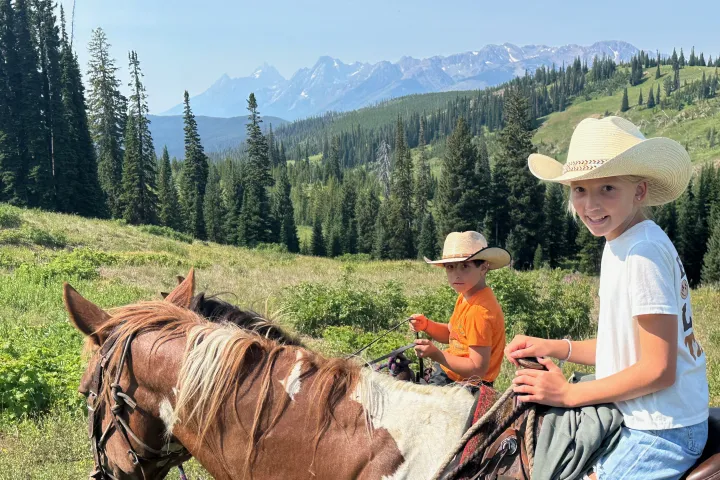 a children riding horses