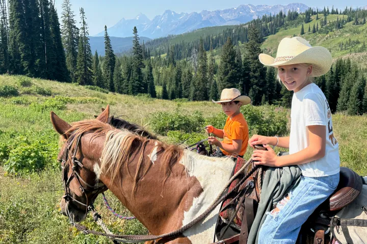 a children riding horses