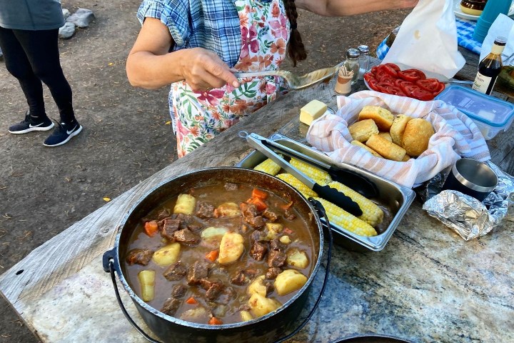a person cooking food in a bowl